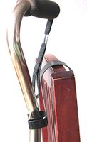 Cane Companion over the chair cane holder - keeps your cane off of the floor - so easy to use - restores dignity to using a cane