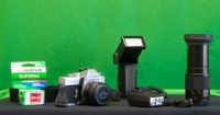 Minolta srT101 with tele, strobe, flash, hand mount, 50 mm lense, and case