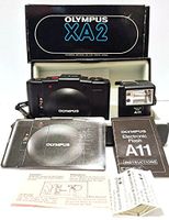 Olympus XA2 35mm Film Flash Camera w/Olympus D-Zuiko 1:3.5 f=35mm Lens Made In Japan with FLASH ASA 25, 50, 100, 200, 400, 800 with Olympus Electronic Flash A11 Atachment (Black in Color)