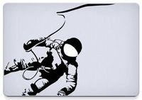 Astronaut Vinyl Decal Sticker Skin for MacBook Laptop in black.