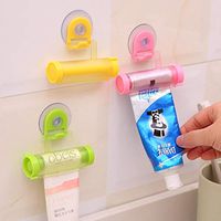 HuntGold Plastic Toothpaste Tube Squeezer Rot/ating Paste Dispenser Sucker Hanging Holder Random Color