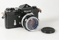 BLACK NIKON F BODY WITH PRISM FINDER NIKKOR 50MM F 1.4 LENS SER# 6473884