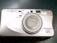 Minolta Co., LTD. Minolta Freedom Zoom 125 Multi AF Auto Focus 35mm Film Camera W/ Minolta Aspherical Lens 37.5-125mm Zoom Lens (Silver Color Version)