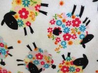 'NUGGLEBUDDY Microwavable Moist Heat & Aromatherapy Organic Rice Pack. Amusing Flowery Black Sheep Flannel Fabric with SPEARMINT EUCALYPTUS Aromatherapy.