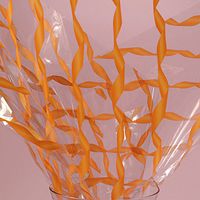 KraftyKlassics 30" x 100' Orange Twist Design Clear Polypropylene Cello Film Gift Basket Wrap Filler Roll