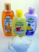 4 Item Sesame Street Bathing Bundle - 1 Baby Shampoo, 1 Hair and Body Baby Wash, 1 Night Time Lotion and 1 Bath Scrubby