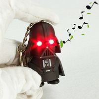 Darth Vader Light Up Key Chain - Tough Black Rubber Plastic Construction With Push Button Helmet to Activate Evil LED Eyes
