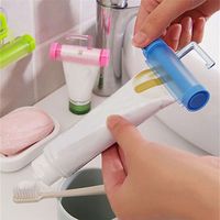 preliked Useful Plastic Rolling Tube Squeezer Toothpaste Easy Dispenser Bathroom Holder (Blue)