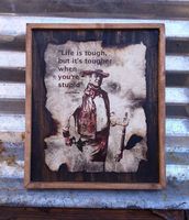Life is tough but it's tougher when you're stupid. John Wayne - Wooden Sign