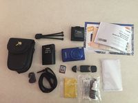 Canon PowerShot ELPH 190 IS Blue Digital Camera 64GB Card Bundle includes Camera, 64GB Memory Card, Reader, Wallet, Case, Battery, Mini Tripod, Screen Protectors, Cleaning Kit and Beach Camera Cloth